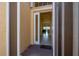 A home's entryway with tiled floors leads to a living area with natural light at 4821 Grand Banks Dr, Wimauma, FL 33598