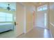 Hallway with tile floors and light-colored walls at 4821 Grand Banks Dr, Wimauma, FL 33598