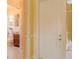 Hallway featuring a view of the bathroom and front door at 4821 Grand Banks Dr, Wimauma, FL 33598