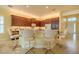 Spacious kitchen with a breakfast bar, recessed lighting, tile floors, and ample cabinet space at 4821 Grand Banks Dr, Wimauma, FL 33598