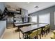 Chef's kitchen in clubhouse featuring stainless steel appliances, island, and seating at 4821 Grand Banks Dr, Wimauma, FL 33598