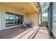 Outdoor patio featuring brick pavers and views of the backyard and lake at 4821 Grand Banks Dr, Wimauma, FL 33598