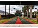 Recreational shuffleboard courts with shade structures and nearby palm trees at 4821 Grand Banks Dr, Wimauma, FL 33598