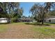 Spacious backyard showcasing a screened pool enclosure, great for outdoor activities and relaxation at 5305 Lenoir Ct, Plant City, FL 33566
