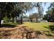 Expansive backyard view featuring a screened pool enclosure, perfect for outdoor relaxation at 5305 Lenoir Ct, Plant City, FL 33566