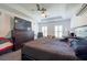 Tranquil main bedroom with tray ceiling, ceiling fan, plush carpet, and decorative windows at 5305 Lenoir Ct, Plant City, FL 33566