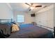 Bedroom featuring ceiling fan, air conditioning, and carpeted floors at 5305 Lenoir Ct, Plant City, FL 33566