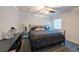 Bedroom with a ceiling fan, window, and black metal bed frame at 5305 Lenoir Ct, Plant City, FL 33566