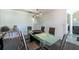 Well-lit dining room features a glass-top table, six chairs, and stylish lighting at 5305 Lenoir Ct, Plant City, FL 33566
