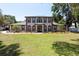 Beautiful two-story home with a large front yard and meticulously maintained landscaping at 5305 Lenoir Ct, Plant City, FL 33566