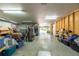 A large garage with plenty of storage space, with an open passage to the exterior at 5305 Lenoir Ct, Plant City, FL 33566