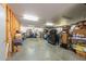 Expansive garage with ample room for storage, equipment, and projects, featuring concrete floors at 5305 Lenoir Ct, Plant City, FL 33566