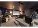 Home theater with tiered seating and plush leather recliners at 5305 Lenoir Ct, Plant City, FL 33566