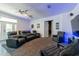 Spacious living area features home theater seating and entertainment area at 5305 Lenoir Ct, Plant City, FL 33566