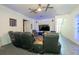 Home theater living room is equipped with leather seating, large TV, and ample space at 5305 Lenoir Ct, Plant City, FL 33566