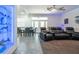 Inviting living area with tile and carpet floors, home theater seating, and decorative display at 5305 Lenoir Ct, Plant City, FL 33566
