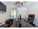 A well-lit office with neutral walls, carpeted floors, and a sleek black desk at 5305 Lenoir Ct, Plant City, FL 33566