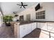 Outdoor kitchen on a brick patio, ideal for entertaining at 5305 Lenoir Ct, Plant City, FL 33566
