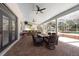 Extended brick patio with outdoor kitchen and dining area perfect for entertaining at 5305 Lenoir Ct, Plant City, FL 33566