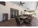 Spacious brick patio with a large dining table and outdoor kitchen at 5305 Lenoir Ct, Plant City, FL 33566