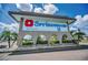 Entrance to the Springwood II community with a large sign and lush greenery at 5480 Orange Blossom N Rd, Pinellas Park, FL 33782