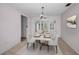 Dining room features natural light and a modern table set at 5480 Orange Blossom N Rd, Pinellas Park, FL 33782