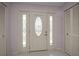 Bright foyer features tiled floor and closet space at 5480 Orange Blossom N Rd, Pinellas Park, FL 33782