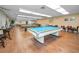 Well-lit game room with pool tables and card tables, perfect for social gatherings at 5480 Orange Blossom N Rd, Pinellas Park, FL 33782