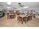 Spacious game room with tables, chairs, and bright, natural lighting at 5480 Orange Blossom N Rd, Pinellas Park, FL 33782