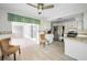 Spacious kitchen featuring stainless steel appliances and access to dining area at 5480 Orange Blossom N Rd, Pinellas Park, FL 33782