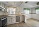 Bright kitchen with modern stainless steel dishwasher and oven at 5480 Orange Blossom N Rd, Pinellas Park, FL 33782