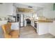 Efficient kitchen layout with stainless steel appliances and bright lighting at 5480 Orange Blossom N Rd, Pinellas Park, FL 33782