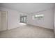 Bright living room with carpeting and natural lighting at 5480 Orange Blossom N Rd, Pinellas Park, FL 33782