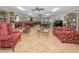 Inviting lounge area with cozy seating, bookshelves, and natural light at 5480 Orange Blossom N Rd, Pinellas Park, FL 33782