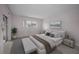 Bright main bedroom featuring modern furnishings and large window at 5480 Orange Blossom N Rd, Pinellas Park, FL 33782
