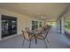 Covered patio with tile flooring, ceiling fans, and sliding glass doors offering views of the outdoors at 5480 Orange Blossom N Rd, Pinellas Park, FL 33782