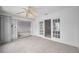 Sunroom featuring sliding glass doors, ceiling fan, and access to multiple rooms at 5480 Orange Blossom N Rd, Pinellas Park, FL 33782