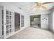Sunroom featuring sliding glass doors, ceiling fan, and views into other rooms at 5480 Orange Blossom N Rd, Pinellas Park, FL 33782