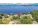 Panoramic aerial view of a lakeside home with private docks and serene water views at 550 George S St, Tarpon Springs, FL 34688