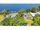 Stunning aerial view of a lakeside property with mature trees and private boat docks at 550 George S St, Tarpon Springs, FL 34688