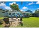 Relaxing backyard featuring a cozy fire pit and ample seating for outdoor gatherings at 550 George S St, Tarpon Springs, FL 34688