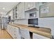 Bright kitchen featuring ample cabinet space, modern appliances, and hardwood flooring for a seamless cooking experience at 550 George S St, Tarpon Springs, FL 34688