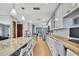 Spacious kitchen with island seating, stainless steel appliances, and wooden floors at 550 George S St, Tarpon Springs, FL 34688