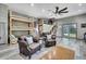 Open-concept living room featuring a loft with bunkbeds, and plank-style flooring at 550 George S St, Tarpon Springs, FL 34688