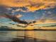 Beautiful sunset with colorful clouds reflecting over tranquil waters at 550 George S St, Tarpon Springs, FL 34688