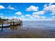 Beautiful water view showcasing a private dock, boat, and serene waterfront living at 550 George S St, Tarpon Springs, FL 34688