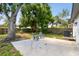 Charming backyard featuring a patio, lawn area, and mature trees for outdoor enjoyment at 5624 62Nd N St, St Petersburg, FL 33709