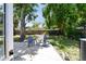 Serene backyard with a patio area, mature trees providing shade and a tranquil setting at 5624 62Nd N St, St Petersburg, FL 33709
