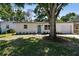 Charming single story home featuring a well-manicured lawn and painted brick facade at 5624 62Nd N St, St Petersburg, FL 33709