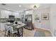 Bright kitchen with stainless steel appliances and updated countertops, adjacent to eating area at 5624 62Nd N St, St Petersburg, FL 33709